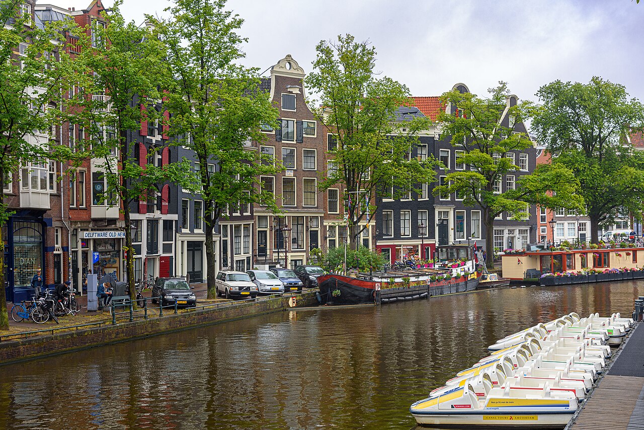 Canal-side houses and moored boats along Amsterdam's Prinsengracht