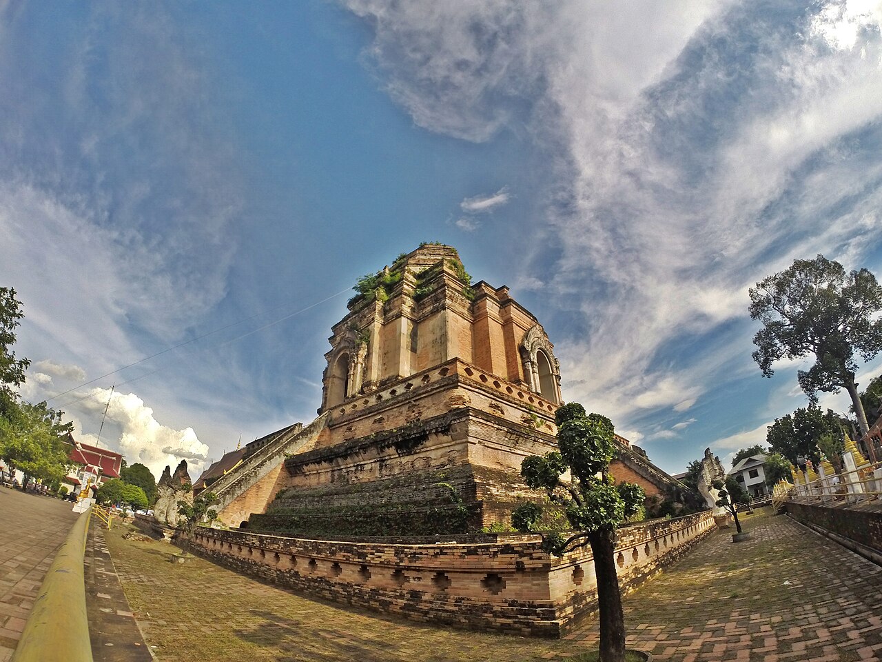 The brick chedi at Wat Chedi Luang in Chiang Mai beneath streaked clouds