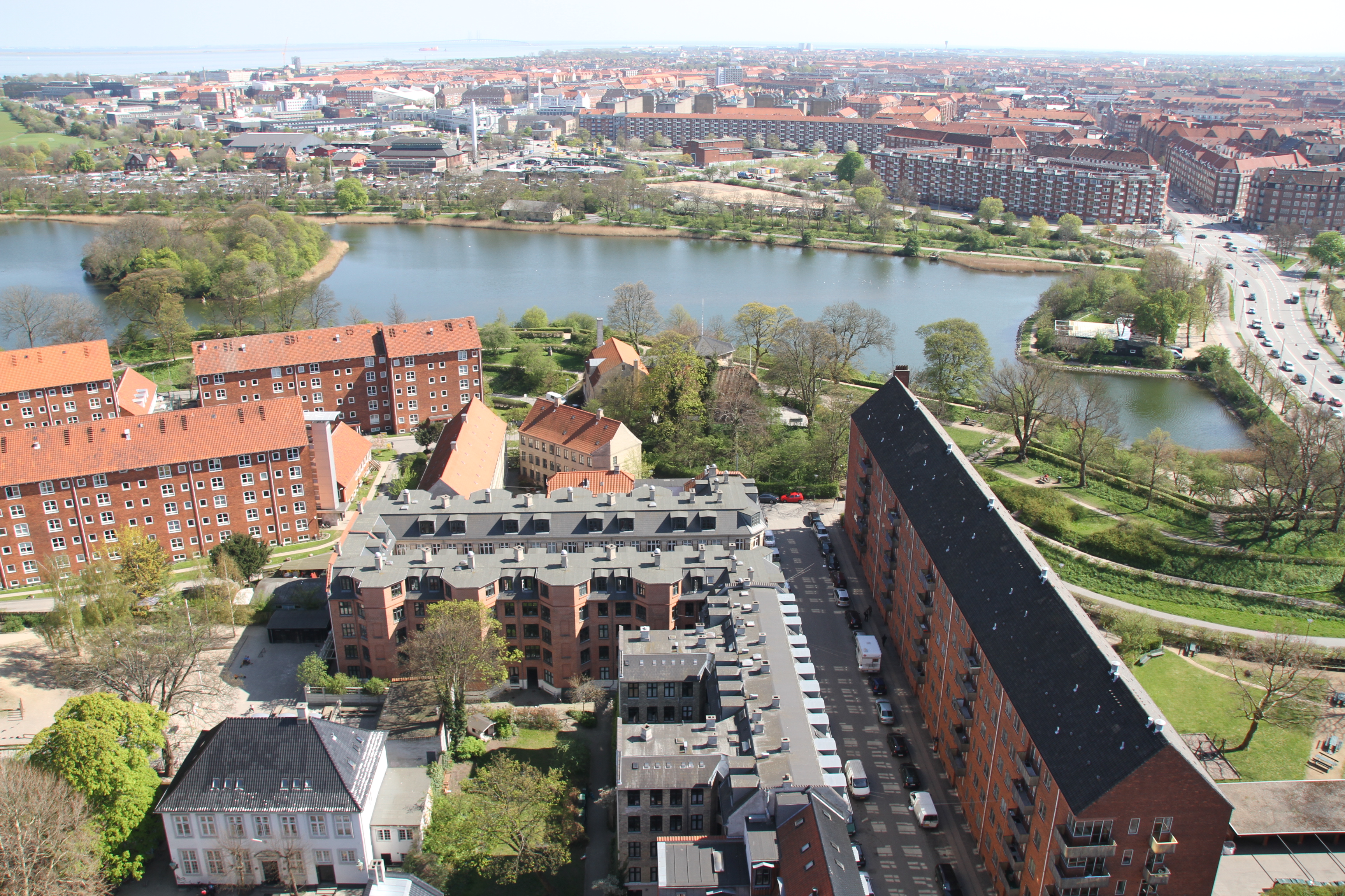 Red-roofed Christianshavn buildings beside the water in Copenhagen, viewed from above