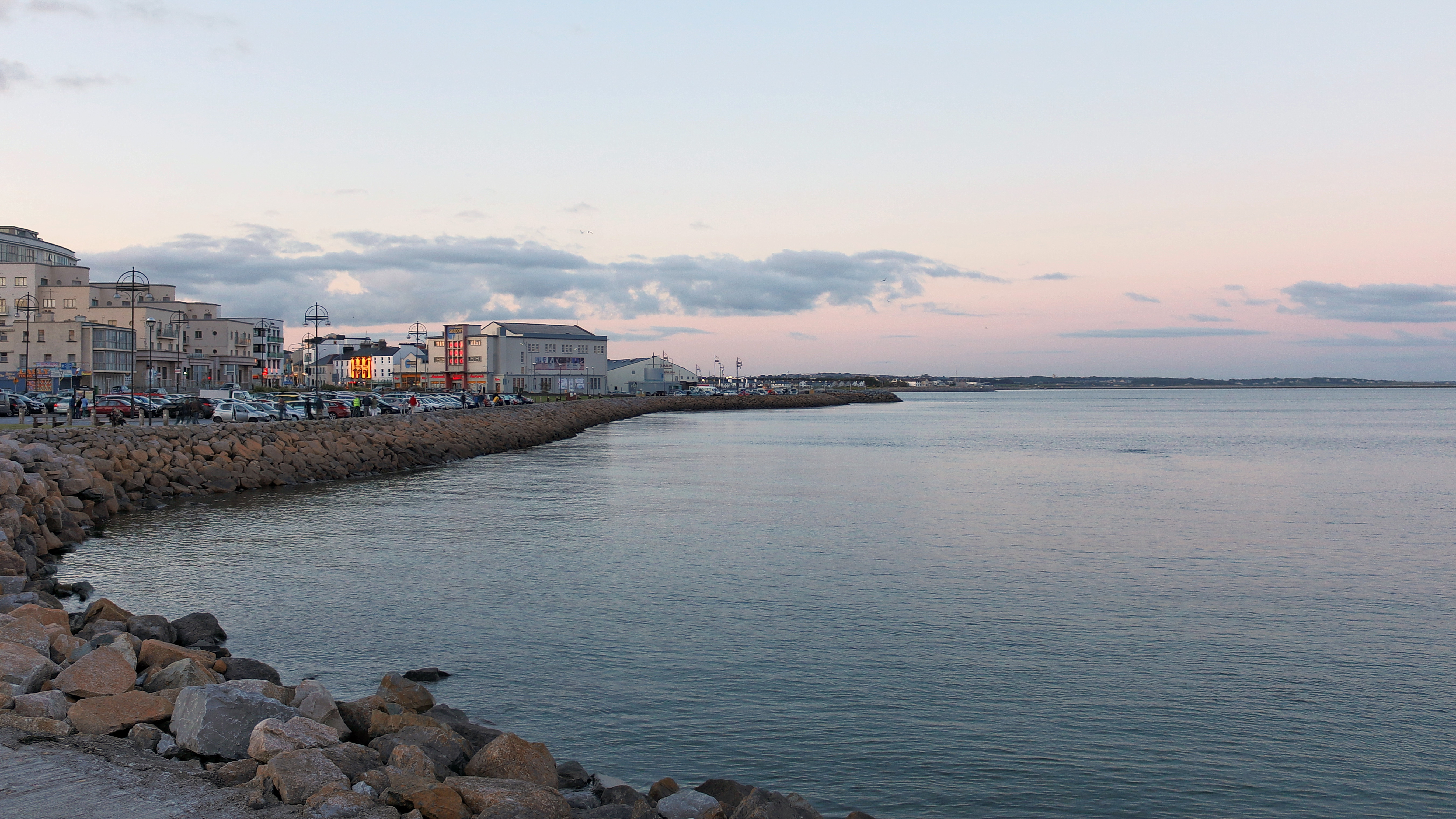 Salthill promenade beside Galway Bay with buildings and a curved shoreline
