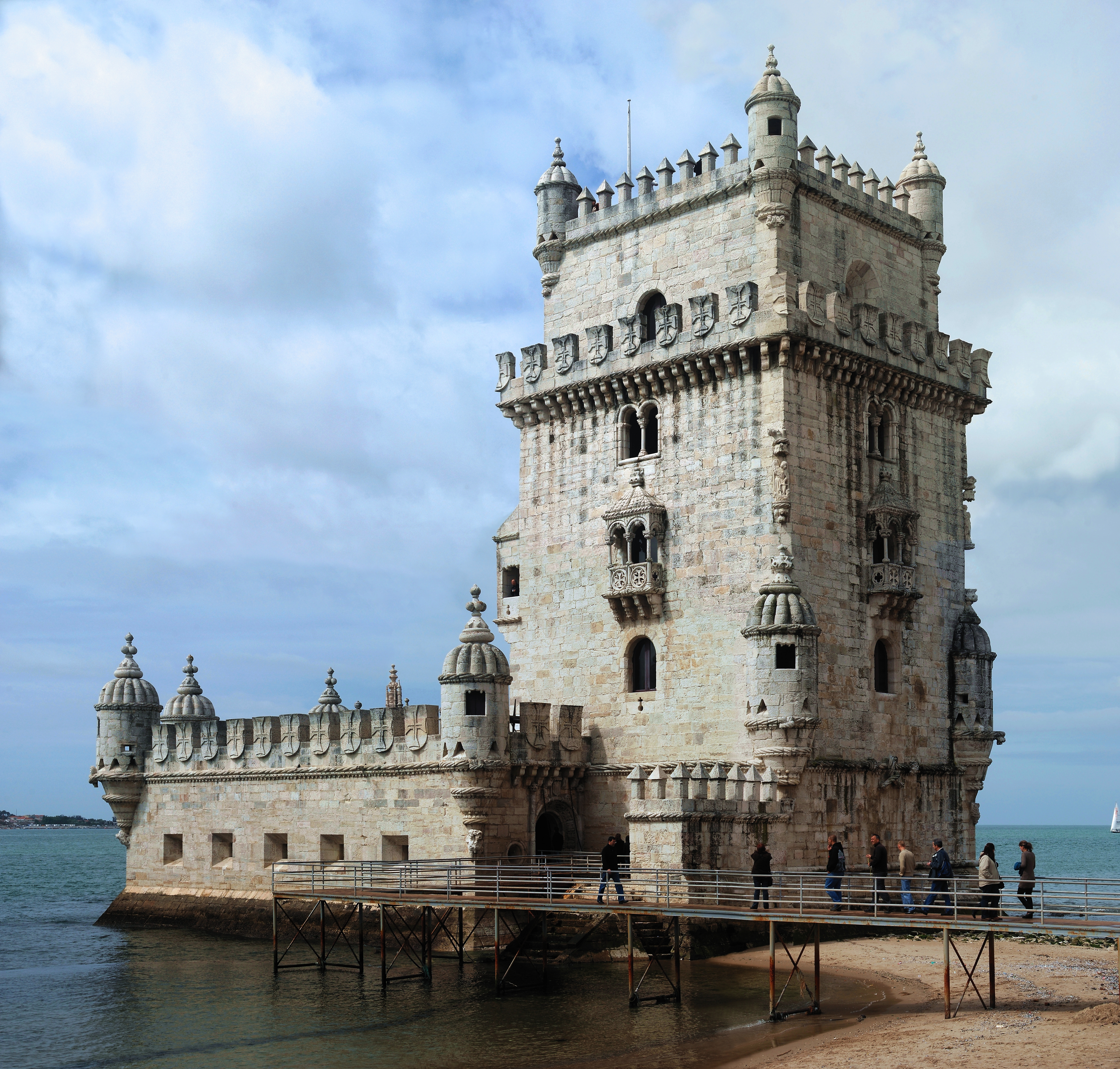 The pale stone Belém Tower beside the Tagus, with its fortified terrace and the river beyond