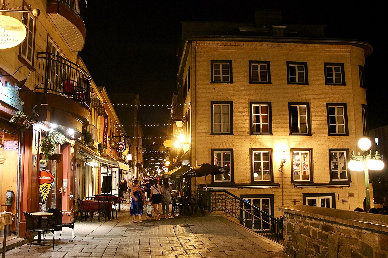 Stone buildings and shopfronts on rue du Petit-Champlain in Québec City at dusk
