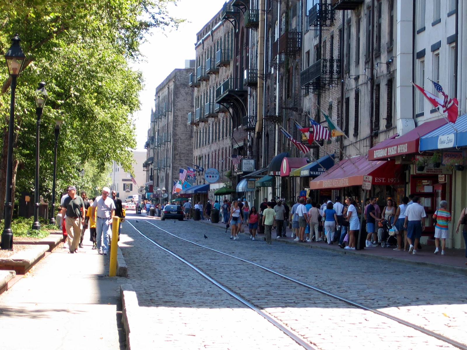 Historic Savannah River Street buildings and street paving in a historical daylight photograph
