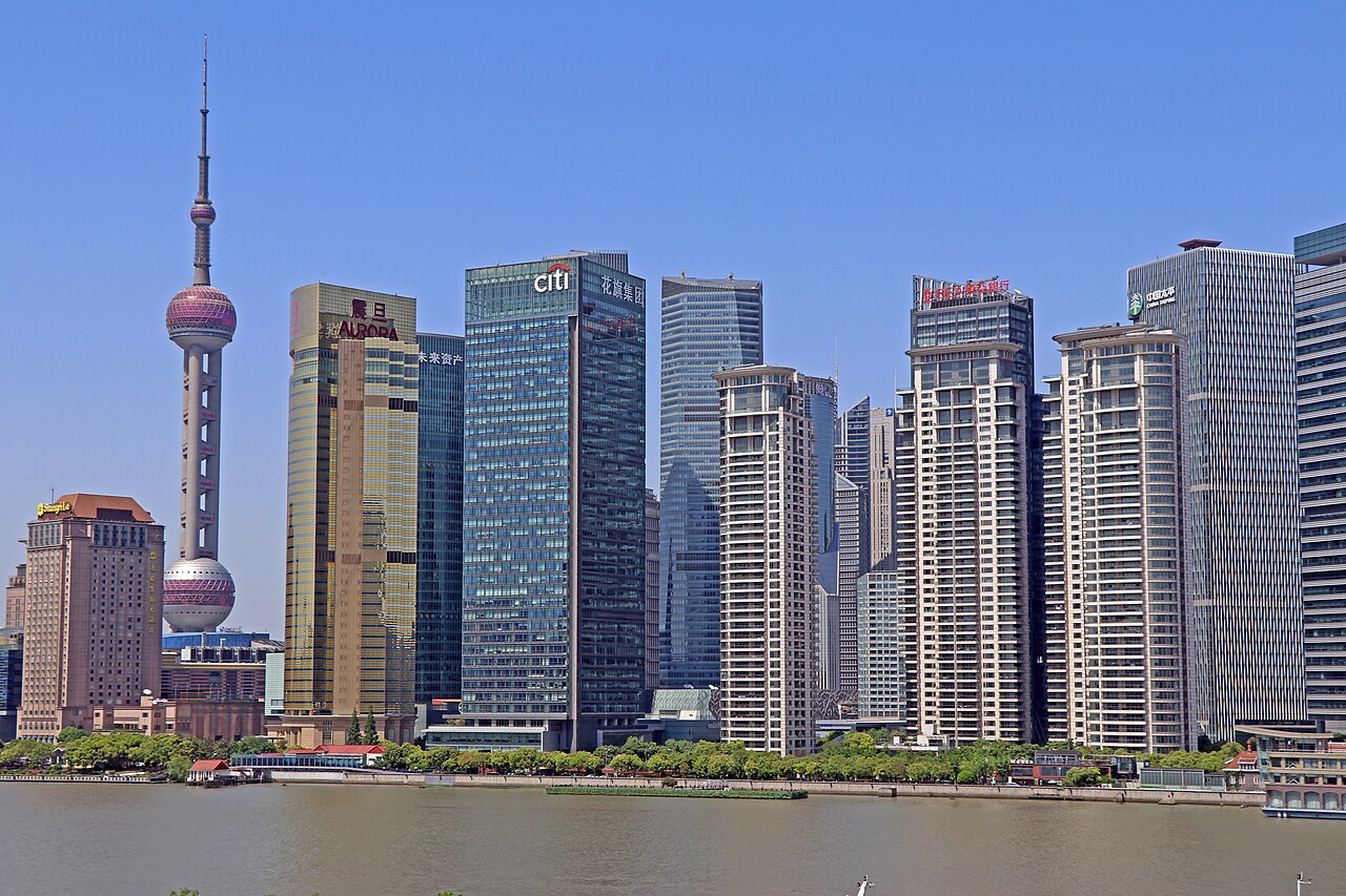 Shanghai Pudong skyline beside the Huangpu River, with the Oriental Pearl Tower on the left in daylight
