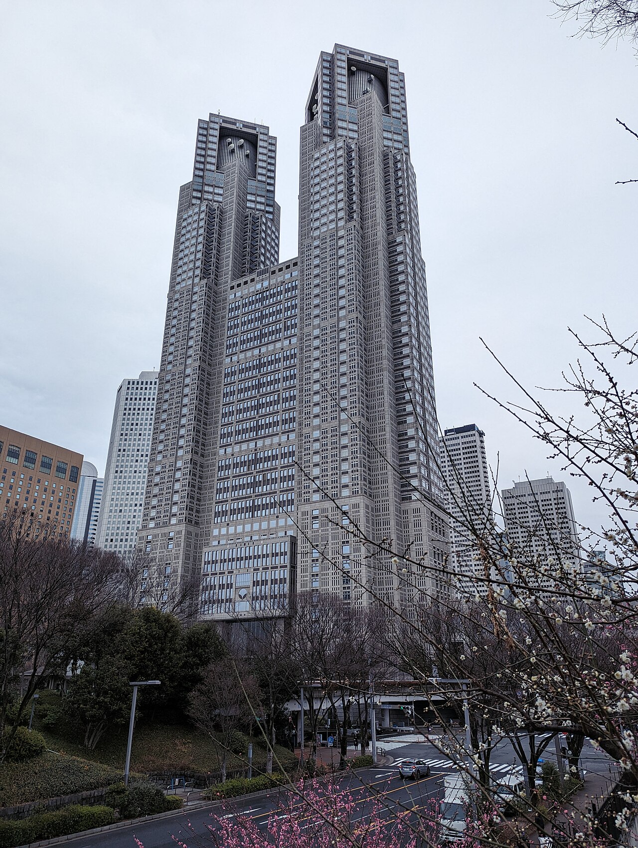 Tokyo Metropolitan Government towers and nearby Shinjuku buildings seen from the park